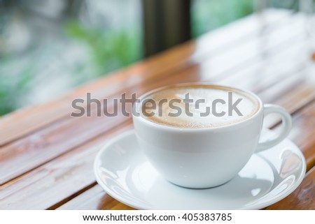 Latte Coffee art on the wooden table