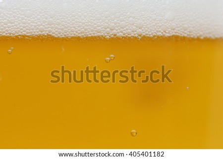 close-up background of beer in the glass