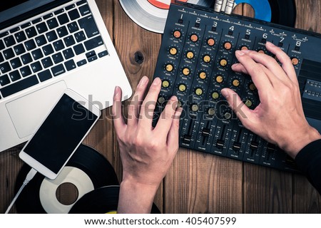 Mixer, laptop and smartphone Royalty-Free Stock Photo #405407599