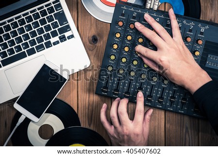 Mixer, laptop and smartphone Royalty-Free Stock Photo #405407602