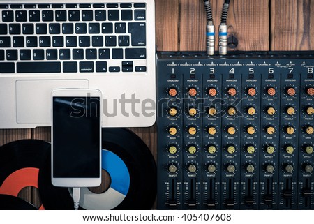 Mixer, laptop and smartphone Royalty-Free Stock Photo #405407608