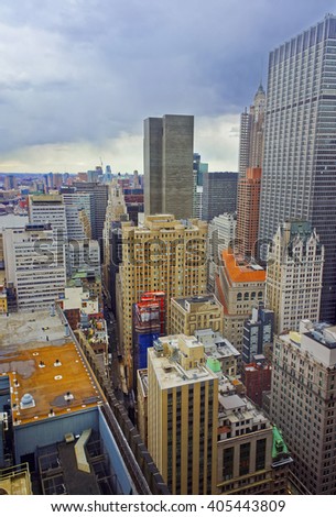 Aerial view on roofs of Lower Manhattan skyscrapers in New York, USA. Jersey City, New Jersey, USA, on the background. East River separates New York and New Jersey.