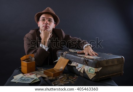 Numismatist with his coin collection