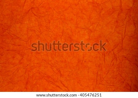 Texture of orange striped crumpled paper for pattern background