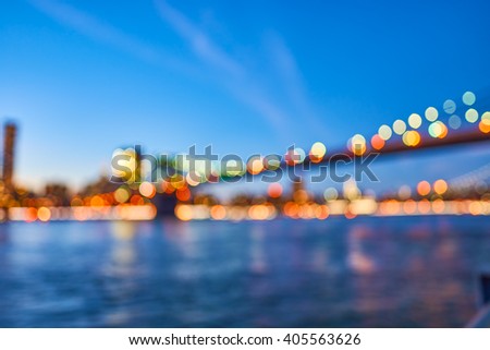 Defocused view of New-York City downtown from Brooklyn at evening