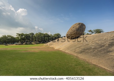 Krishna's butterball, the giant natural balancing rock in Mahabalipuram, Tamil Nadu, India Royalty-Free Stock Photo #405613126