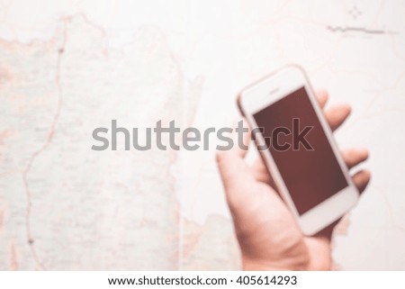 blur background, phone on a map of asia