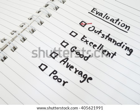 Performance Evaluation check box on white notebook (Business concept)