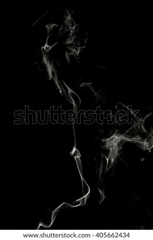 curls of white smoke on a black background