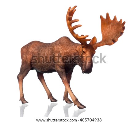 Beautiful collectible figure of an elk on white background with reflection.