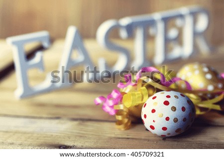 Easter composition flower and eggs on wooden background