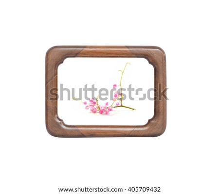 Wooden frame with pink flower isolated on white background