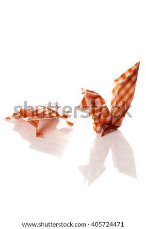 Cute origami animals, frog and squirrel, isolated on white background.