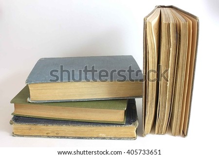 Stack on antique books isolated on white background.