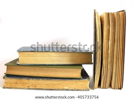 Stack on antique books isolated on white background.