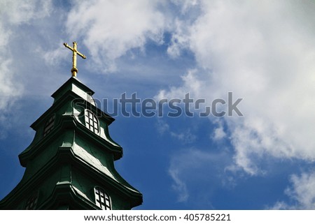cross on church background of blue sky