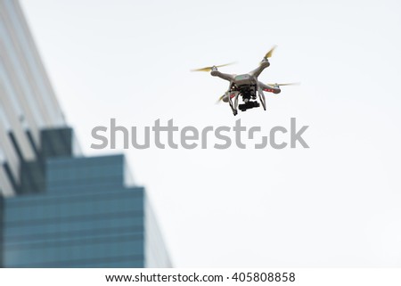 Drone preparing to fly over the city with copy space using as background electronic technology flying monitor system, transportation concept.