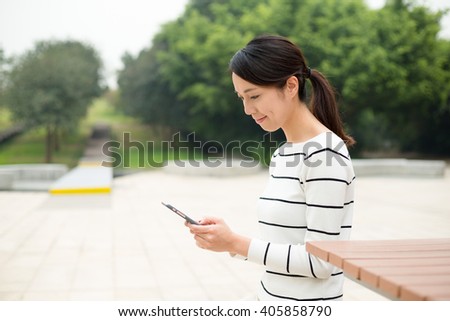 Woman use of cellphone at outdoor