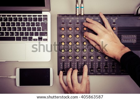 Mixer, laptop and smart phone Royalty-Free Stock Photo #405863587