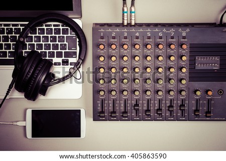 Mixer, laptop and smart phone Royalty-Free Stock Photo #405863590