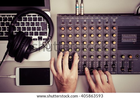Mixer, laptop and smart phone Royalty-Free Stock Photo #405863593