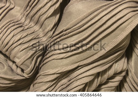 This is a photograph of Textured shiny light Purple fabric background