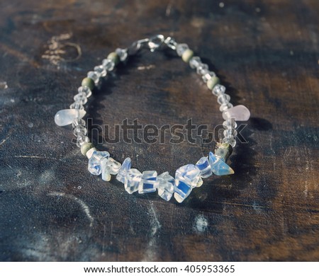 mineral stone yoga bracelet on wooden table