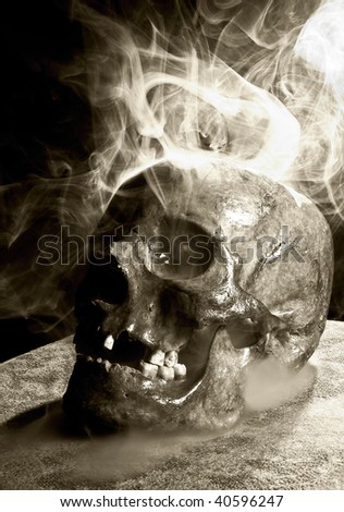 real skull in abstract smoke