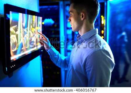 Man using touchscreen in university or museum Royalty-Free Stock Photo #406016767