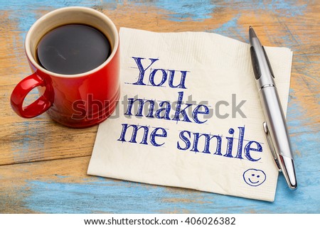 You make me smile  - handwriting on a napkin with a cup of coffee