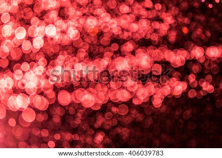 red bokeh of water and lights on black background