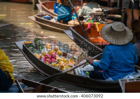 selective focus of fruit in a boat at Damnoen Saduak floating market Ratchaburi near Bangkok, Thailand Royalty-Free Stock Photo #406073092