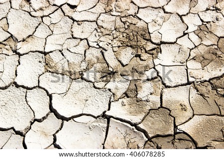 Lake bed drying up due to drought Royalty-Free Stock Photo #406078285
