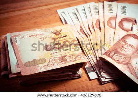 a lot of money on wood background. - Vintage Tone.