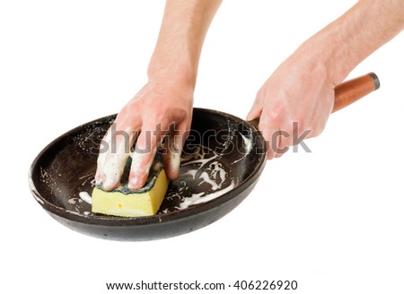 Men hand wash with a sponge pan . Royalty-Free Stock Photo #406226920
