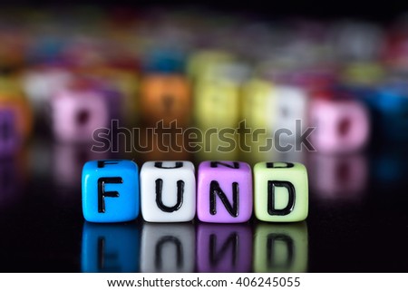 Fund concept on colorful dice