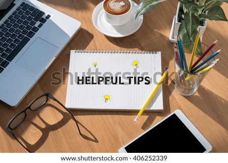 HELPFUL TIPS CONCEPT open book on table and coffee Business