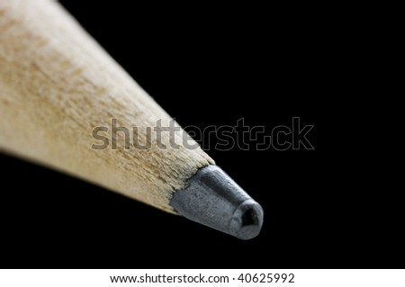 Tip of pencil over black with shallow DOF, focus where the wood meets the graphite
