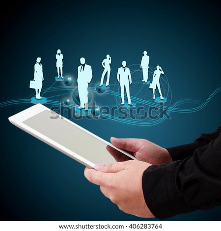 Businessman holding a tablet showing concept of online transactions on virtual screen.