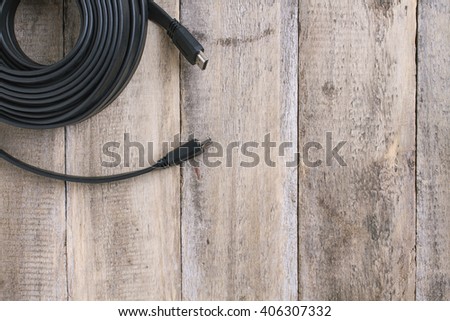 hdmi cable on wooden table - top view