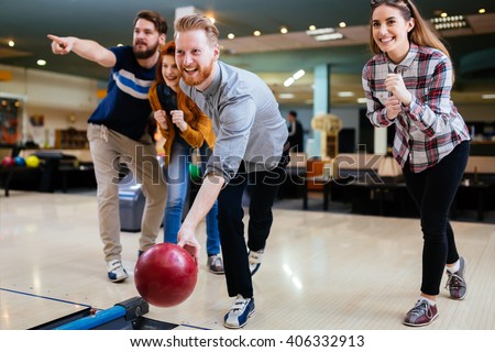 Friends bowling and enjoying moments together