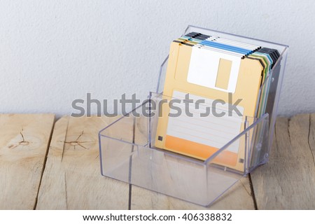 floppy disk in box on wooden floor