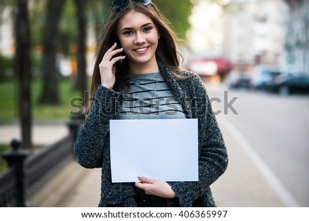 pretty girl holding a white sheet