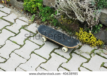 Old child skateboard on the pavement
