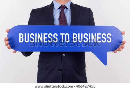 Businessman holding speech bubble with a word B2B