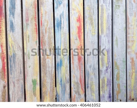 Old shabby paint on the wood background of old paint, abstract background. Old colorful paint on wood background