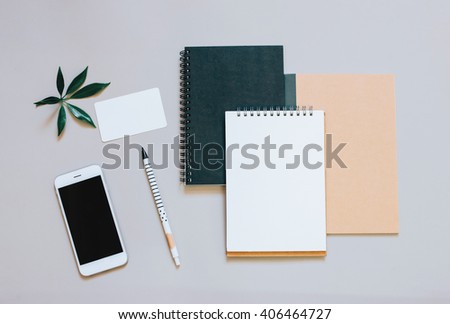 Creative flat lay photo of workspace desk with smartphone, coffee and notebook with copy space background, minimal style
