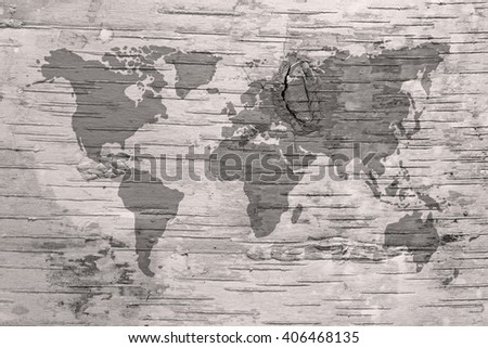 Black and white world map on birch cork natural texture background 