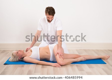 Photo Of young woman receiving chiropractor massage