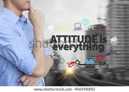 young man stand and thinking with ATTITUDE IS EVERYTHING  text ,